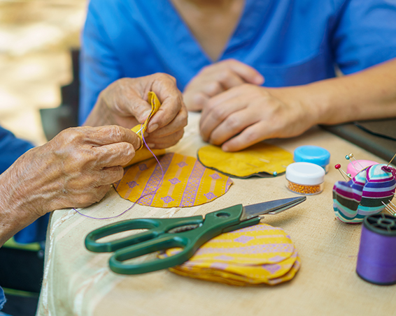 residents sat down doing easter themed arts and crafts