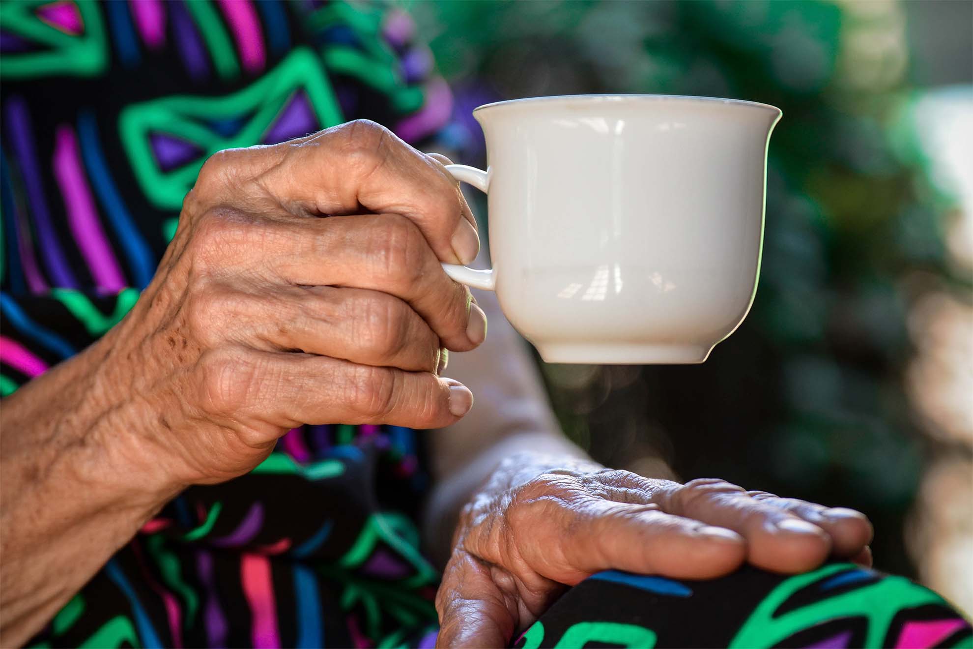older woman with a mug in her hand